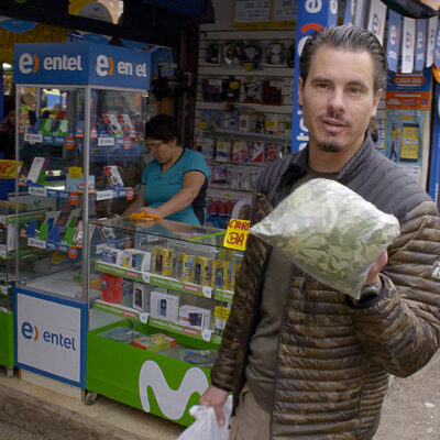 Timothy Alberino buying coca leaves in the Andes mountains of Peru while on expedition to a lost city.