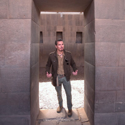 Timothy Alberino standing in the megalithic trapezoidal door at the Coricancha (Qorikancha), Peru.