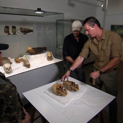 Timothy Alberino examining elongated skulls with Chase Kloetzke and L.A. Marzulli in Paracas, Peru.
