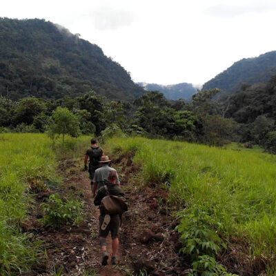 Timothy Alberino and Gary Heavin walking through Alberino's property in the Amazon jungle, Peru.