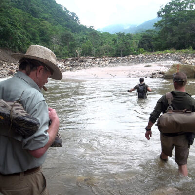 Timothy Alberino and Gary Heavin hiking to Alberino's property in the Amazon jungle, Peru.