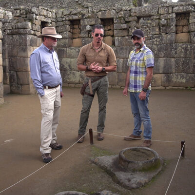 Timothy Alberino examining the star mirror pools at Machu Picchu with Gary Heavin.