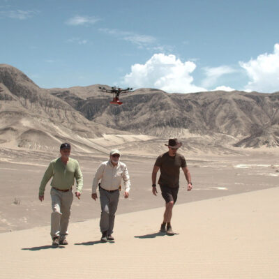 Timothy Alberino, Gary Heavin, and Anselm Pi Rambla, scanning with a GPR drone in Paracas, Peru.