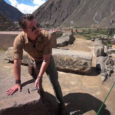 Timothy Alberino examining the megalithic blocks at Ollantaytambo, Peru.