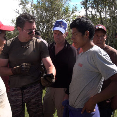 Timothy Alberino consulting with villagers on expedition to a lost city in the Andes mountains of Peru.