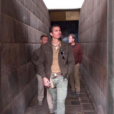 Timothy Alberino and Gary Heavin walking through the megalithic passageway at the Coricancha (Qorikancha), Peru.