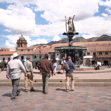 Timothy Alberino and his expedition team walking through the Plaza de Armas in Cusco, Peru.