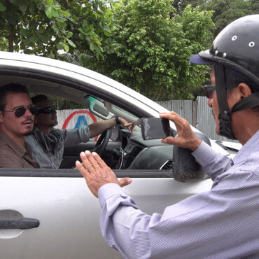Timothy Alberino being interviewed by a Peruvian reporter on expedition to a lost city in the Andes mountains of Peru.