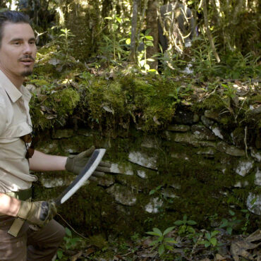 Timothy Alberino exploring the ruins of a lost city in the Andes mountain of Peru.