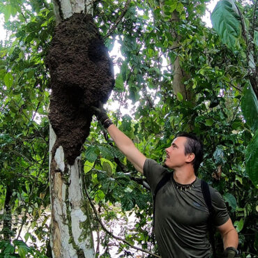 Timothy Alberino hiking to his property in the Amazon jungle.