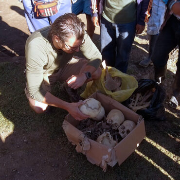 Timothy Alberino inspecting the bones of an ancient people from a lost Inca city high in the Andes mountains of Peru.