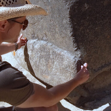 Timothy Alberino studying megalithic stones at Ollantaytambo, Peru.