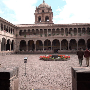 Timothy Alberino and Gary Heavin walking through the courtyard at the Coricancha (Qorikancha), Peru.
