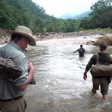 Timothy Alberino and Gary Heavin hiking to Alberino's property in the Amazon jungle, Peru.