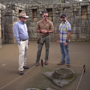 Timothy Alberino examining the star mirror pools at Machu Picchu with Gary Heavin.