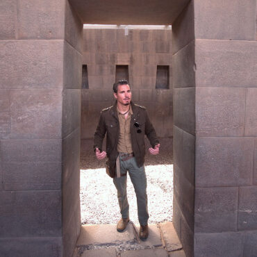 Timothy Alberino standing in the megalithic trapezoidal door at the Coricancha (Qorikancha), Peru.